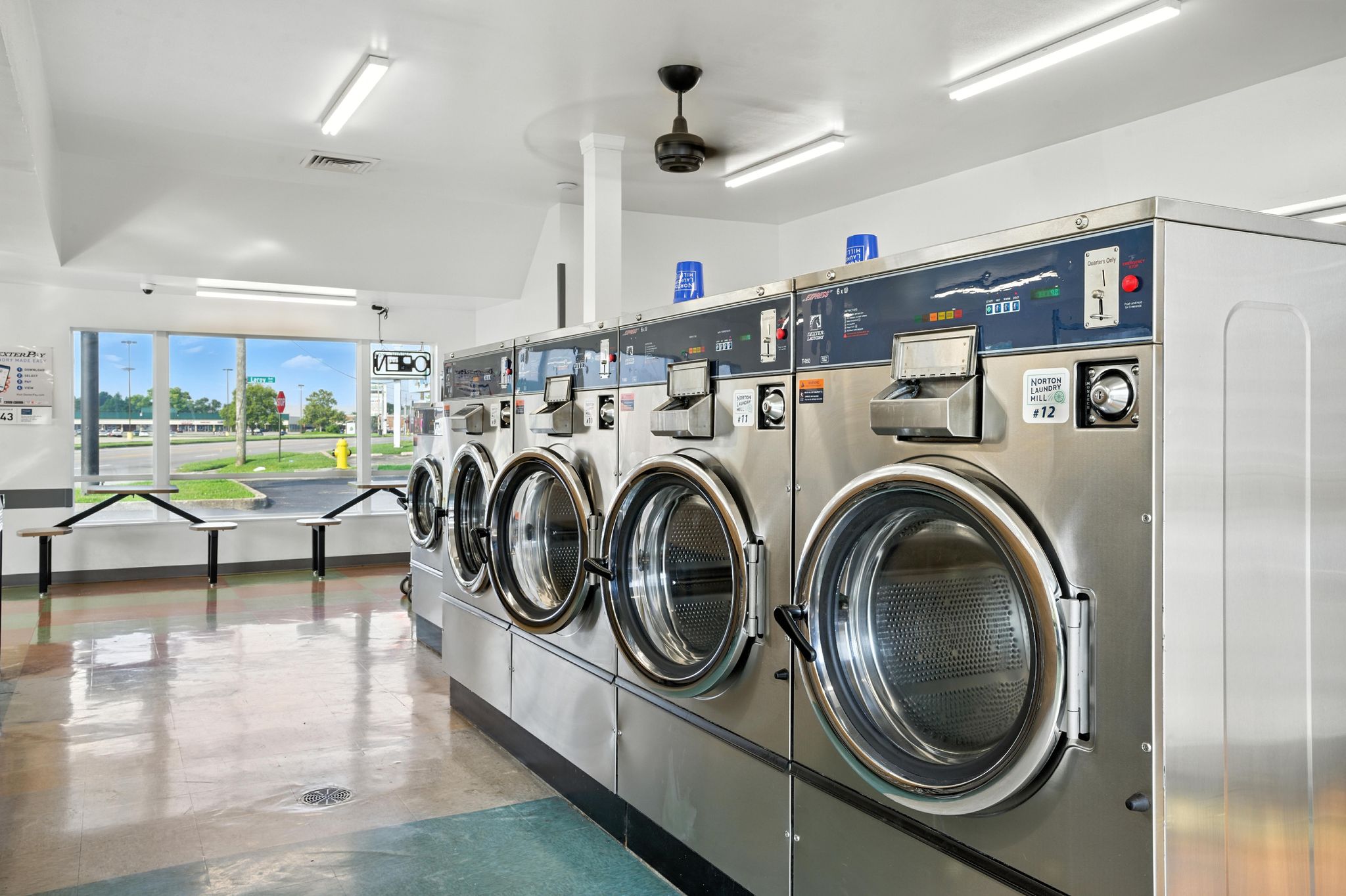 Washers and folding tables inside Norton Laundry Mill in Shively